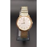 GENTLEMEN'S 1970s OMEGA DE VILLE NINE CARAT GOLD CASED WRISTWATCH the champagne dial with baton five