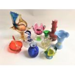 SELECTION OF COLOURFUL GLASS VASES AND ORNAMENTS comprising a frilly rimmed vase with two lions to