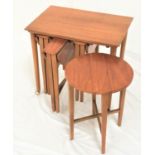 TEAK OCCASIONAL TABLE with an oblong top standing on turned supports with castors, with four drop