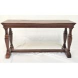 OAK CONSOLE TABLE with a rectangular quarter veneered top, standing on four turned and tapering