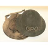 WWII BRITISH STEEL HELMET marked GPO, with adjustable chin strap and over shoulder carry pouch