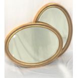 PAIR OF OVAL GILTWOOD WALL MIRRORS with bevelled plates, 79cm x 60cm (2)