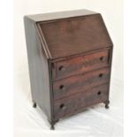 OAK BUREAU with a fall flap opening to reveal a fitted interior above three long drawers, standing