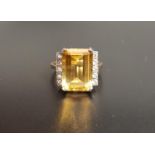 LARGE CITRINE AND DIAMOND DRESS RING the central emerald cut citrine approximately 5.3cts flanked by