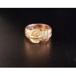 NINE CARAT GOLD BUCKLE DESIGN RING with engraved detail overall, ring size M-N and approximately 6.3