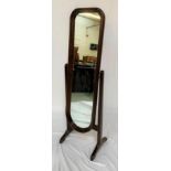STAINED PINE CHEVAL MIRROR with an arched mirror on splayed supports, 143.5cm high