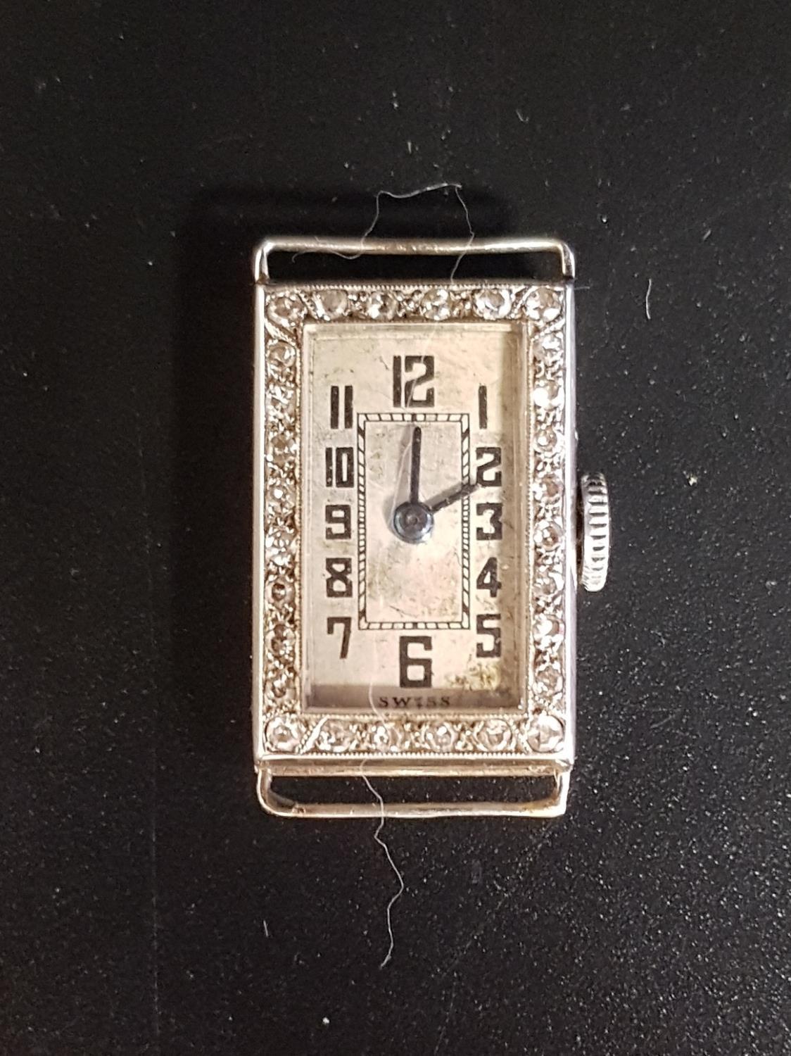1920s DIAMOND SET EIGHTEEN CARAT WHITE GOLD COCKTAIL WATCH the dial with Arabic numerals, the case