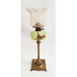 EDWARDIAN OIL LAMP with a brass square base and turned column, the reservoir painted with flowers,