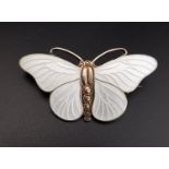 NORWEGIAN ENAMEL DECORATED SILVER BUTTERFLY BROOCH by Svein Kirkhus, in white enamel, 4.7cm wide