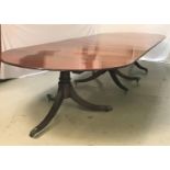 AN IMPRESSIVE LARGE MAHOGANY DINING/BOARD ROOM TABLE with D ends and a central section with two