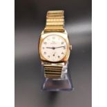 GENTLEMAN'S 1960s NINE CARAT GOLD CASED RECORD WRISTWATCH the dial set with Arabic numerals and