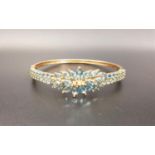 BLUE TOPAZ AND DIAMOND SET BANGLE the central three diamonds in surround of multiple marquise cut
