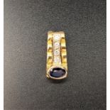 SAPPHIRE AND DIAMOND PENDANT in eighteen carat gold, the oval cut sapphire approximately 0.4cts