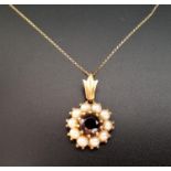 GARNET AND PEARL CLUSTER PENDANT in nine carat gold and on nine carat gold mount