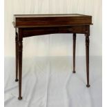 GOTHIC REVIVAL MAHOGANY BIJOUTERIE TABLE with a fold over glass top above an arched frieze with