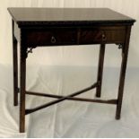 19TH CENTURY STYLE MAHOGANY GAMES TABLE with a swivel fold over baize lined top, above two frieze