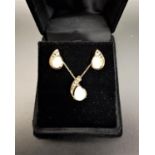 OPAL AND DIAMOND SUITE OF JEWELLERY comprising a pendant on chain with matching stud earrings, the