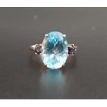 IMPRESSIVE BLUE TOPAZ AND IOLITE DRESS RING the central oval cut topaz approximately 6.4cts