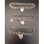 THREE SILVER CURB LINK BRACELETS all with silver heart padlock clasp, total weight 48.3 grams (3)