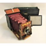 JUNIOR SANDERSON QUARTER PLATE CAMERA with a Beok Symmetrical Lens, with plate holders and a