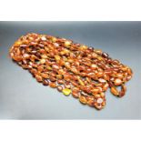 LONG AMBER BEAD NECKLACE individually knotted, approximately 324cm long and 78 grams