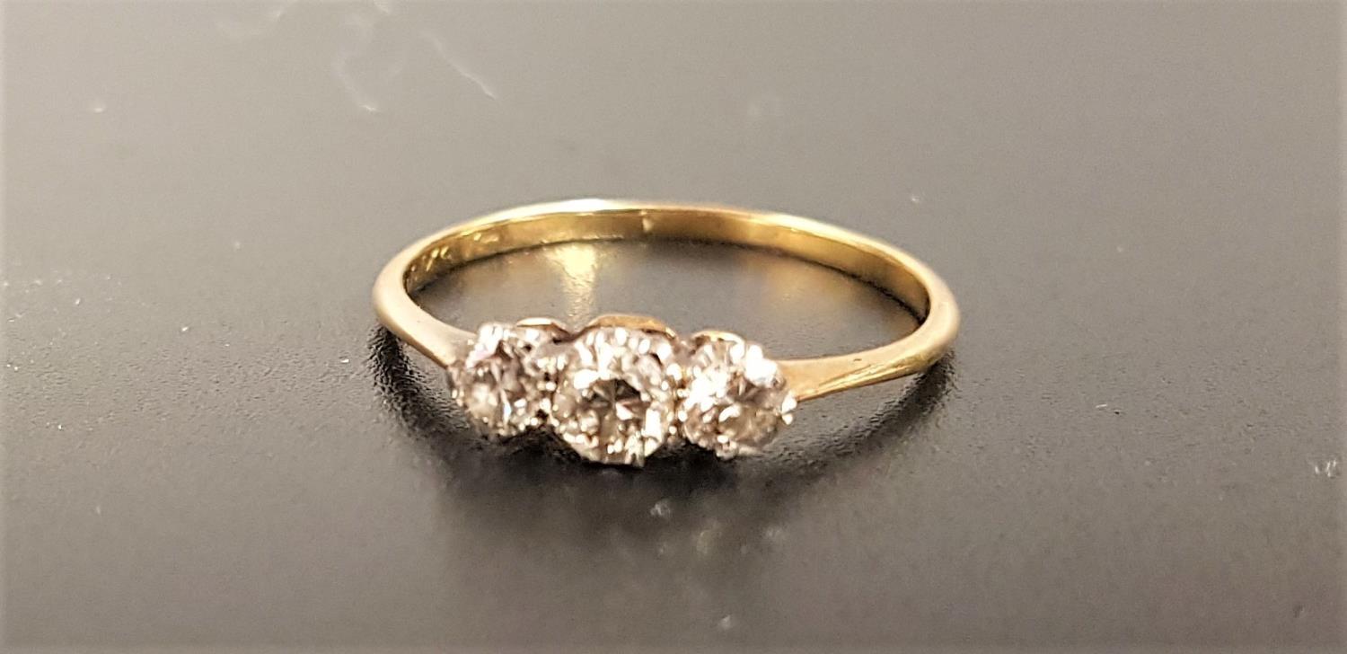 GRADUATED DIAMOND THREE STONE RING the diamonds totaling approximately 0.35cts, on unmarked gold