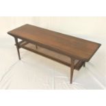 TEAK OCCASIONAL TABLE with an oblong top, standing on tapering supports united by an unusual caned