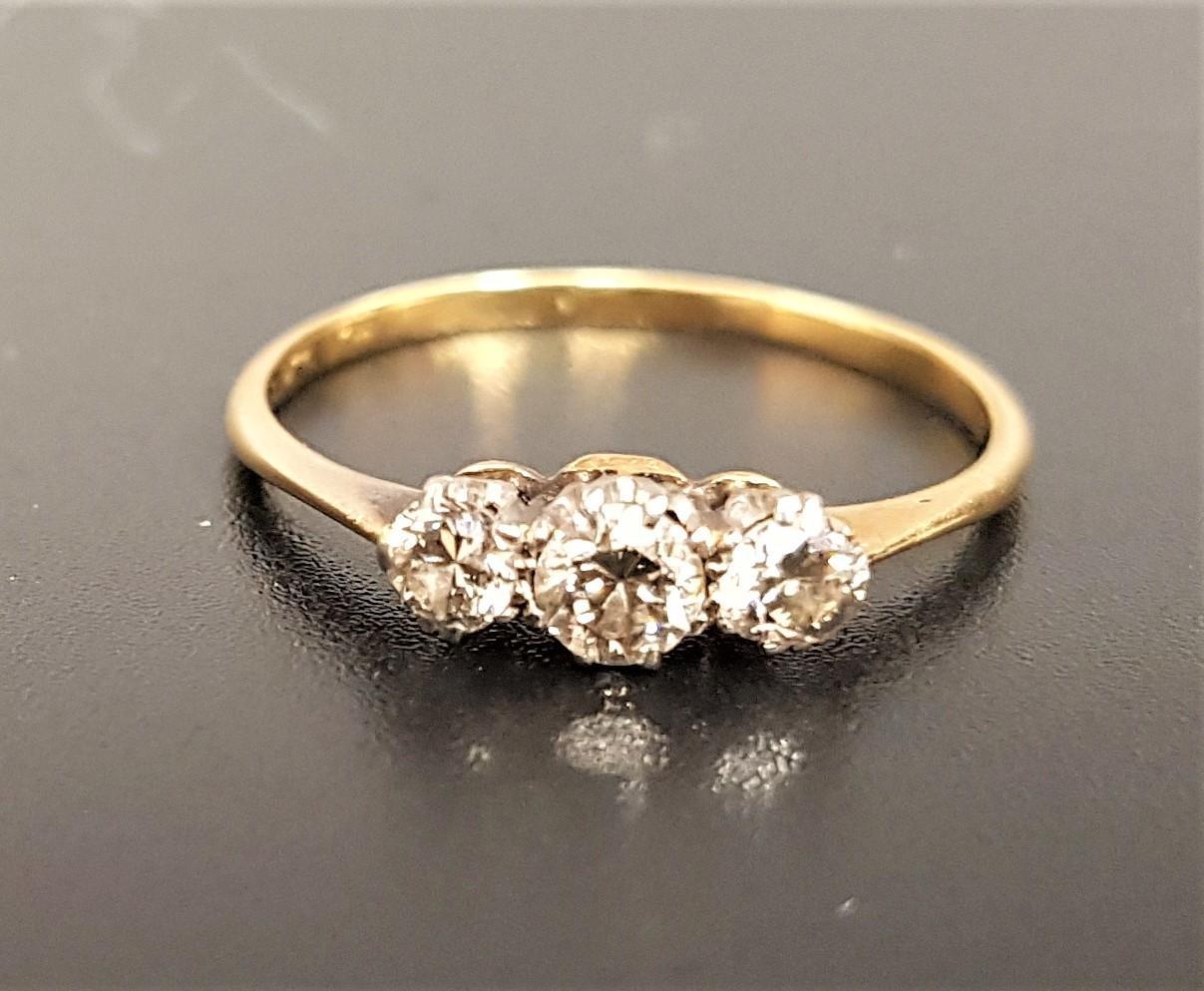 GRADUATED DIAMOND THREE STONE RING the diamonds totaling approximately 0.35cts, on unmarked gold - Image 2 of 2