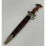 THIRD REICH DRESS DAGGER with a brown hardwood handle inset with eagle and enamel SA, the blade