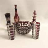 SELECTION OF RUBY FLASH AND ETCHED GLASS PIECES comprising a wine decanter with vine decoration;