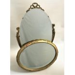 OVAL DRESSING TABLE MIRROR with an oval bevelled plate on a faux marble base, 59cm high, together