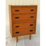 TEAK CHEST OF DRAWERS with four drawers, standing on turned supports, 82cm high