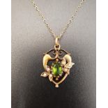 GREEEN GEM AND SEED PEARL PENDANT in fifteen carat gold heart shaped setting and on nine carat