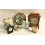 SELECTION OF CLOCKS AND BAROMETERS including a pocket watch style barometer, wooden circular