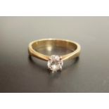 DIAMOND SOLITAIRE RING the round brilliant cut diamond approximately 0.6cts, on eighteen carat