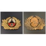 GERMAN NAZI VETERANS CAP BADGE depicting a set of gilt oak leaves surrounding a veterans war