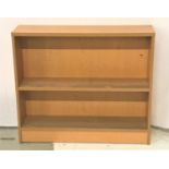 LIGHT OAK OPAEN BOOKCASE with two shelves, one adjustable, standing on a plinth base, 100cm wide