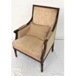 MAHOGANY FRAME ARMCHAIR with a padded back, sides, arms and seat with a loose seat cushion, standing