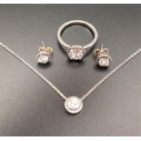 PANDORA ROUND SPARKLE HALO SUITE OF SILVER JEWELLERY comprising a pendant on chain, a ring and a