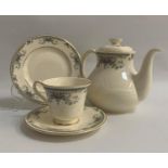 ROYAL DOULTON TEA SERVICE comprising six tea cups and saucers, six side plates and a lidded tea pot,