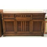 JOHN DICK & SON CHERRY SIDE CABINET with a moulded and crossbanded top above three paneled frieze