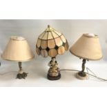 PAIR OF TABLE LAMPS each raised on a circular alabaster base with a gilt metal Putti surmounted by a