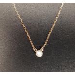 DIAMOND SET NECKLACE the solitaire diamond approximately 0.1cts, on eighteen carat gold chain, total