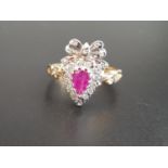UNUSUAL RUBY AND DIAMOND CLUSTER RING the pear cut ruby in diamond surround and surmounted by a