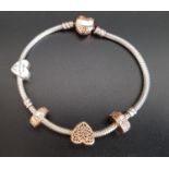 PANDORA SILVER MOMENTS CHARM BRACELET with Rose heart clasp, a Rose heart charm, two Rose clips, and