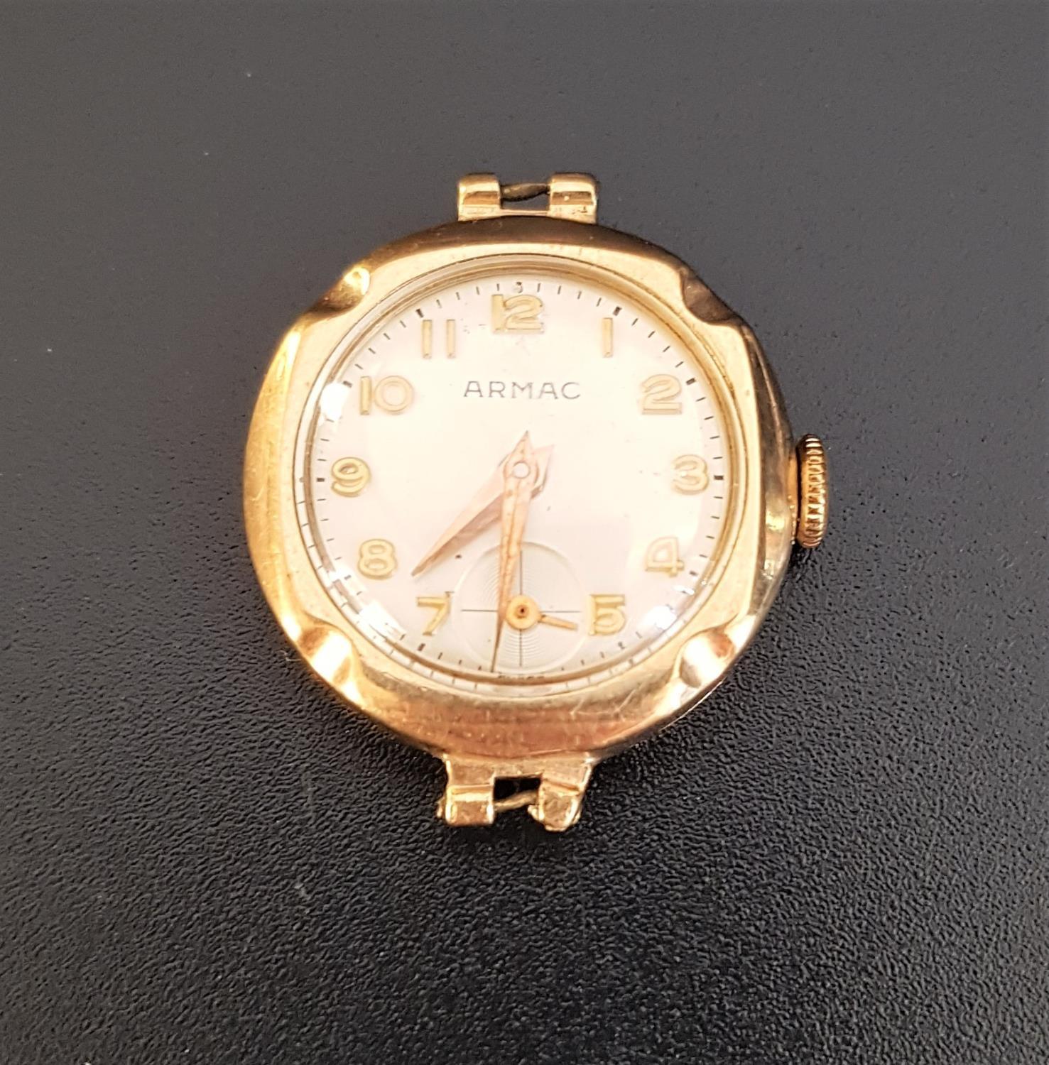 LADIES ARMAC NINE CARAT GOLD CASED WRISTWATCH the champagne dial with Arabic numerals and subsidiary