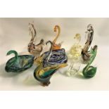 SELECTION OF COLOURFUL GLASS ANIMAL ORNAMENTS comprising six swans and three cockerels, five with