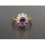AMETHYST AND DIAMOND CLUSTER RING the central oval cut amethyst approximately 0.7cts in ten
