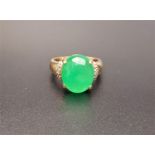 JADE AND DIAMOND DRESS RING the central oval jade cabochon flanked by three small diamonds to each