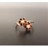 GARNET AND PEARL DOUBLE CLUSTER RING on nine carat gold shank, ring size M